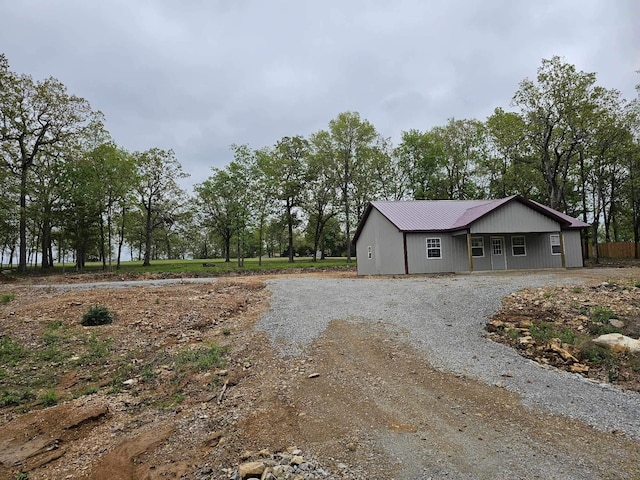 view of side of property with metal roof
