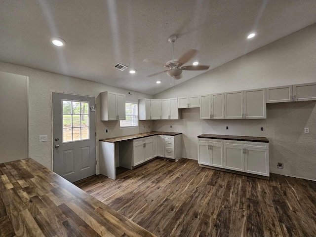 kitchen with vaulted ceiling, ceiling fan, dark wood-type flooring, visible vents, and recessed lighting