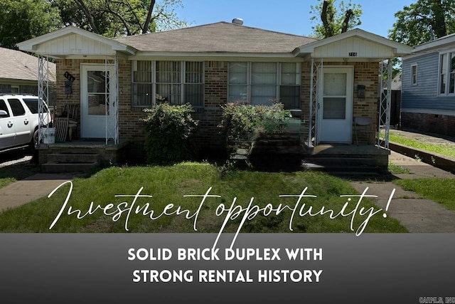 bungalow-style home featuring brick siding