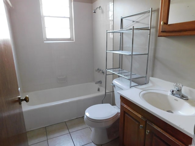 bathroom with toilet, vanity, tile patterned floors, and shower / bathing tub combination