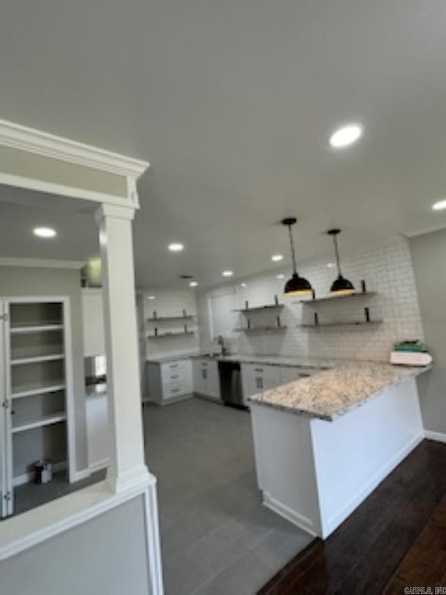 kitchen featuring recessed lighting, backsplash, open shelves, stainless steel dishwasher, and a peninsula