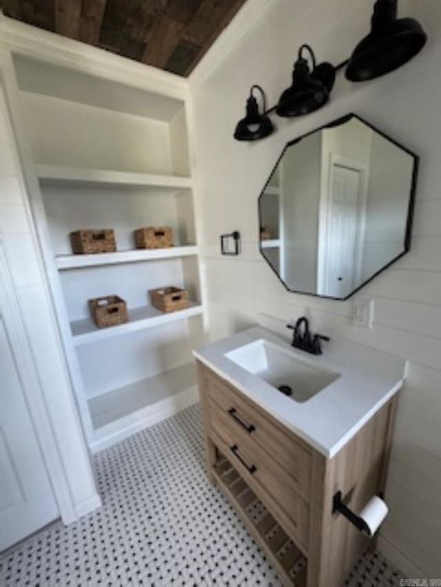 bathroom with vanity and built in shelves