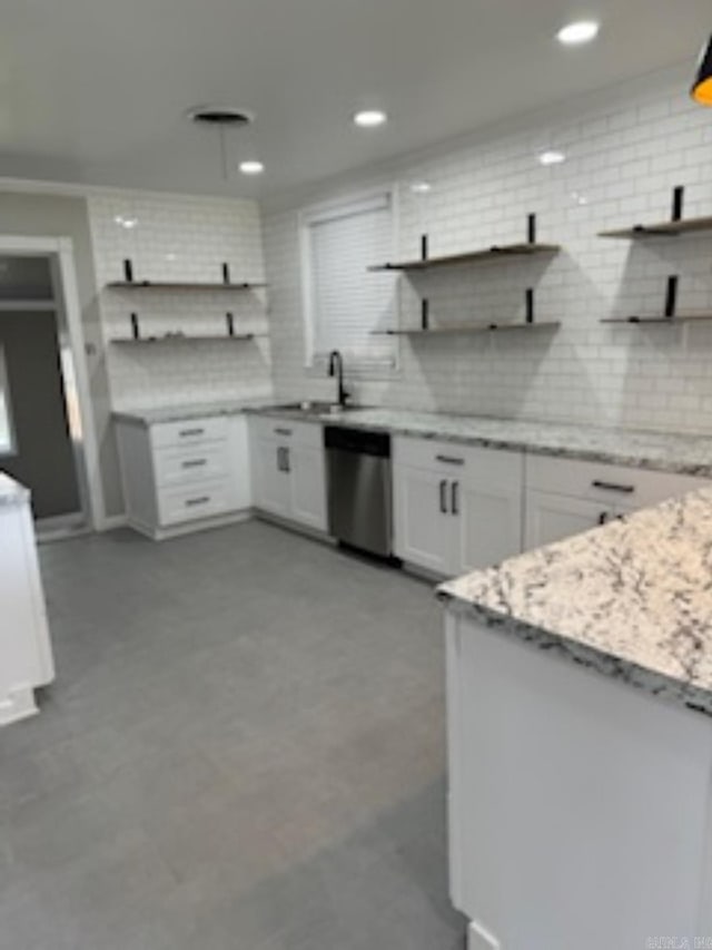 kitchen with open shelves, backsplash, and dishwasher