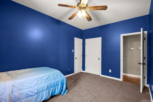 carpeted bedroom with baseboards and ceiling fan