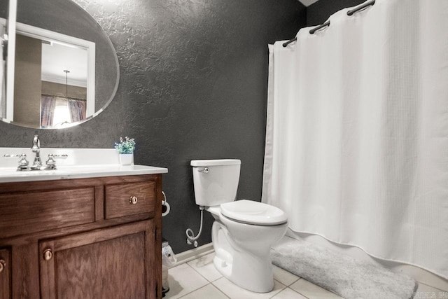 full bathroom with toilet, a shower with shower curtain, tile patterned floors, vanity, and a textured wall
