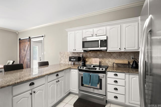 kitchen featuring crown molding, a peninsula, appliances with stainless steel finishes, and decorative backsplash