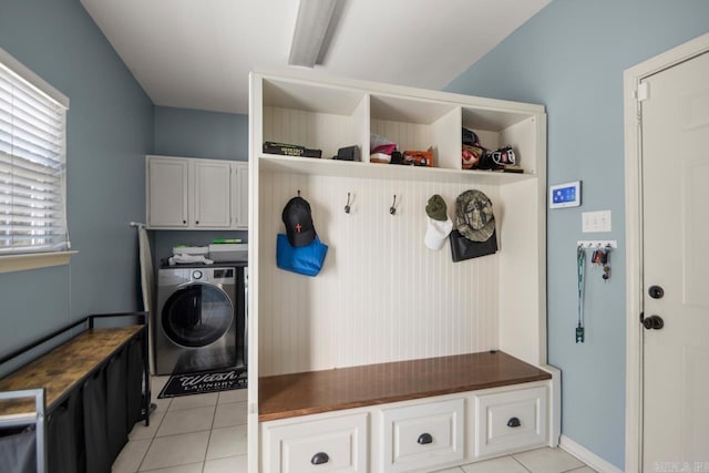 mudroom with light tile patterned flooring and washer / dryer