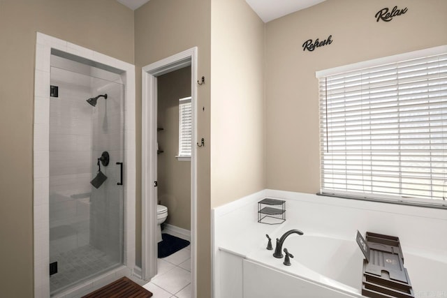 full bath with a stall shower, tile patterned flooring, toilet, and a bath