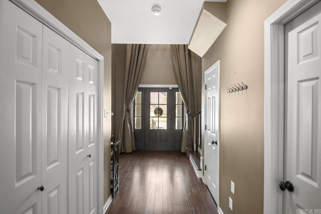 doorway featuring dark wood-type flooring