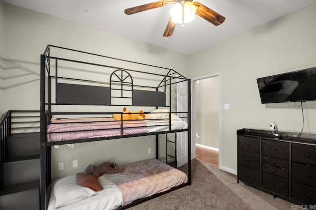 carpeted bedroom with baseboards