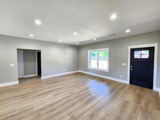 290 Walker St, Higginson, AR 72068 - unfurnished living room featuring light wood-type flooring, baseboards, recessed lighting, and visible vents
