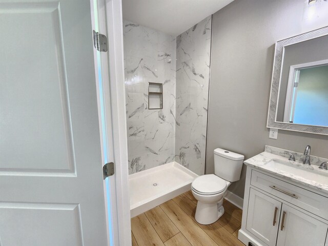 290 Walker St, Higginson, AR 72068 - full bathroom with wood finished floors, a marble finish shower, vanity, and toilet