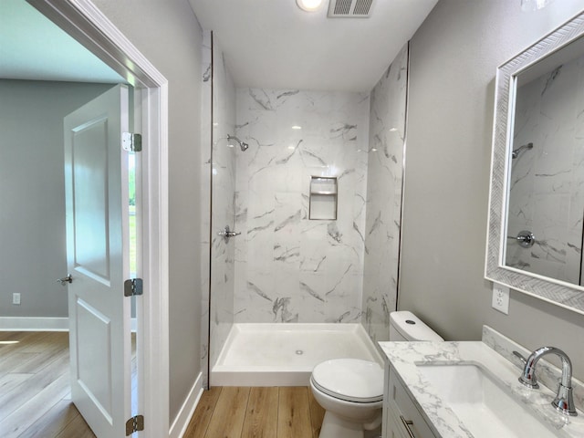290 Walker St, Higginson, AR 72068 - full bathroom with wood finished floors, a marble finish shower, vanity, and toilet