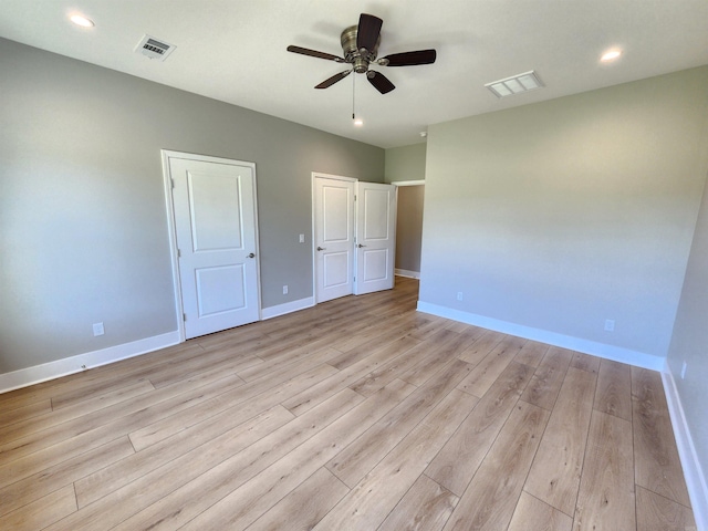 290 Walker St, Higginson, AR 72068 - unfurnished bedroom featuring baseboards, visible vents, and light wood-type flooring