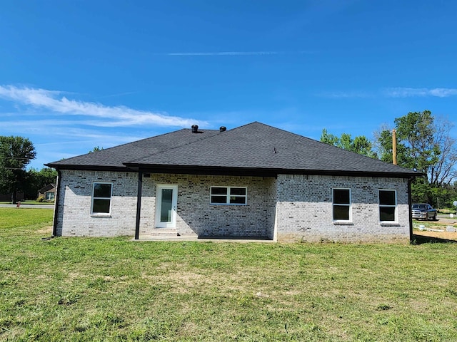 290 Walker St, Higginson, AR 72068 - rear view of house featuring roof with shingles, brick siding, and a yard