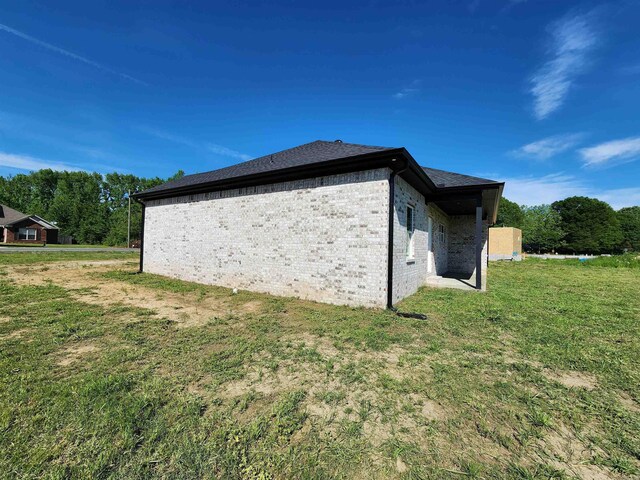 290 Walker St, Higginson, AR 72068 - view of side of property with brick siding and a lawn