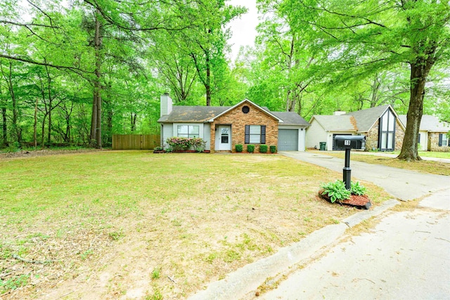 single story home featuring a chimney, fence, driveway, a front yard, and a garage