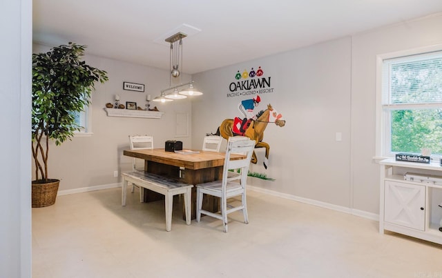dining room featuring baseboards