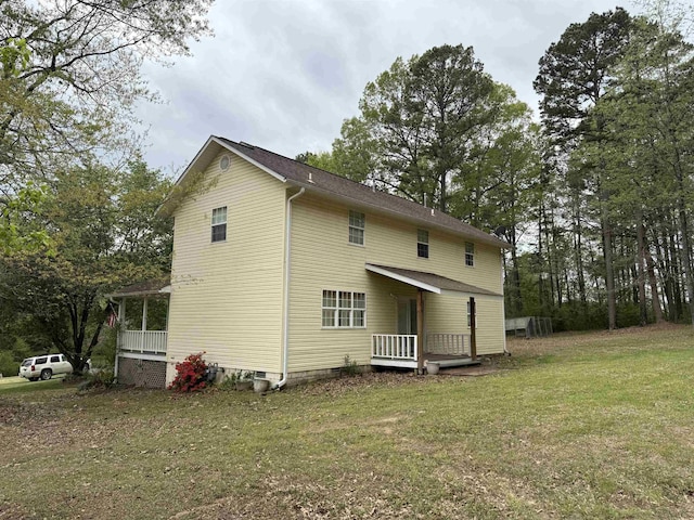 back of property with a yard