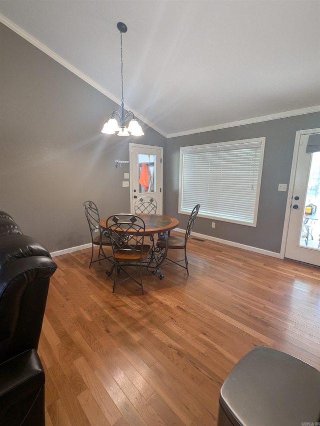 20 Pure Country Rd, Greers Ferry, AR 72067 - dining area featuring lofted ceiling, an inviting chandelier, light wood-type flooring, and crown molding