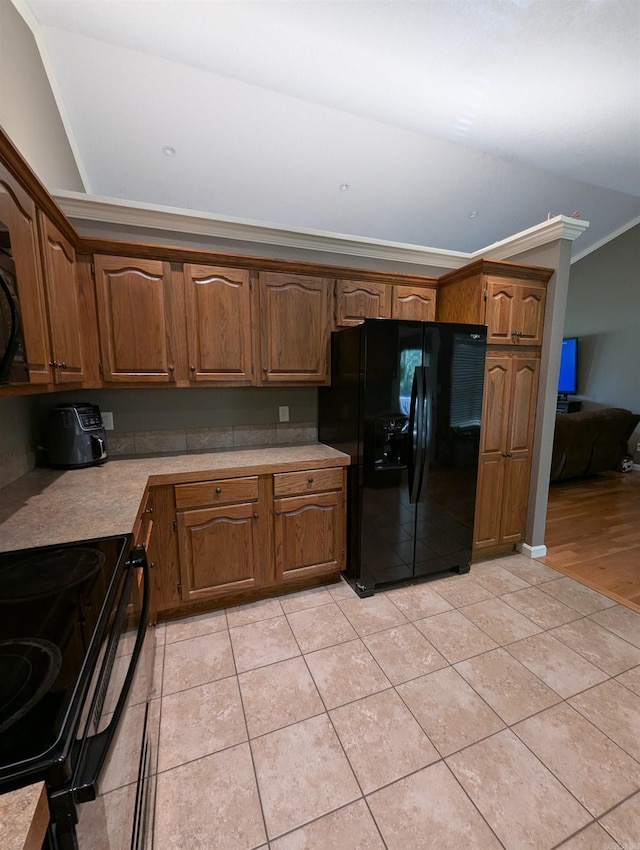 20 Pure Country Rd, Greers Ferry, AR 72067 - kitchen featuring light tile patterned flooring, black appliances, brown cabinetry, light countertops, and ornamental molding