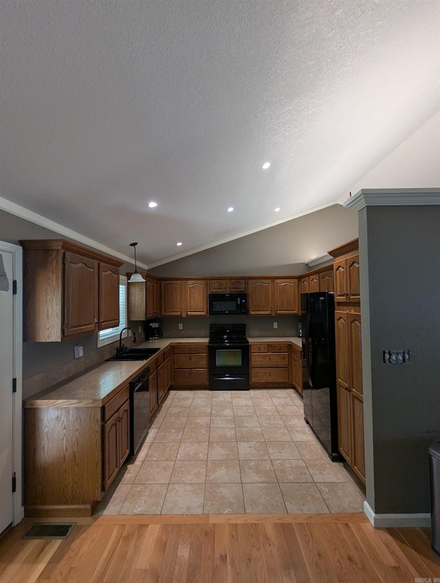 20 Pure Country Rd, Greers Ferry, AR 72067 - kitchen with a sink, vaulted ceiling, visible vents, light wood-style floors, and black appliances