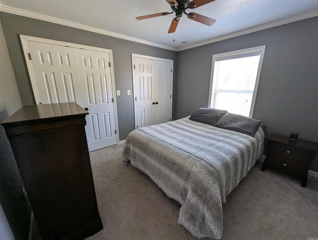 20 Pure Country Rd, Greers Ferry, AR 72067 - bedroom featuring carpet, a ceiling fan, crown molding, baseboards, and two closets