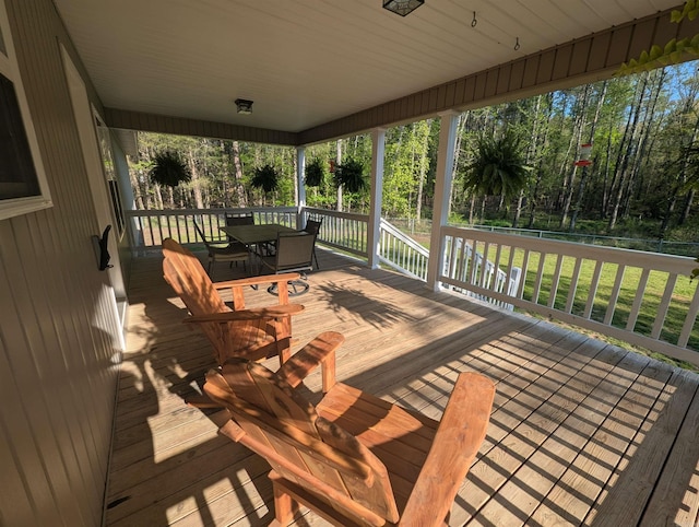 20 Pure Country Rd, Greers Ferry, AR 72067 - wooden deck with outdoor dining space and a lawn