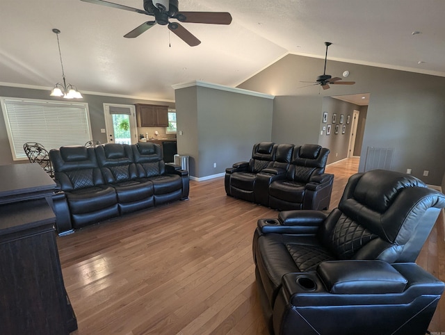 20 Pure Country Rd, Greers Ferry, AR 72067 - living area with vaulted ceiling, wood finished floors, ornamental molding, baseboards, and ceiling fan with notable chandelier