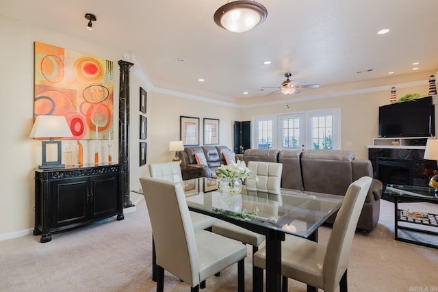 dining space featuring recessed lighting, ceiling fan, crown molding, and light carpet