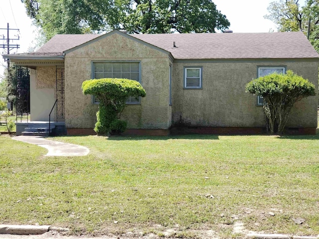 226 Rutherford, Pine Bluff, AR 71601 - back of house with a lawn, a shingled roof, and stucco siding