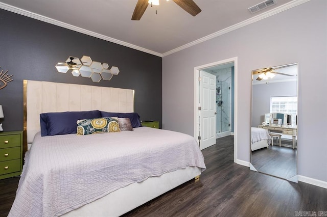 bedroom featuring wood finished floors, visible vents, crown molding, and baseboards
