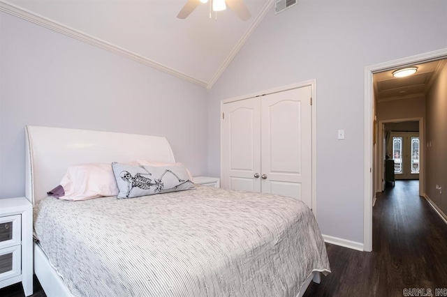 bedroom featuring wood finished floors, vaulted ceiling, visible vents, and crown molding