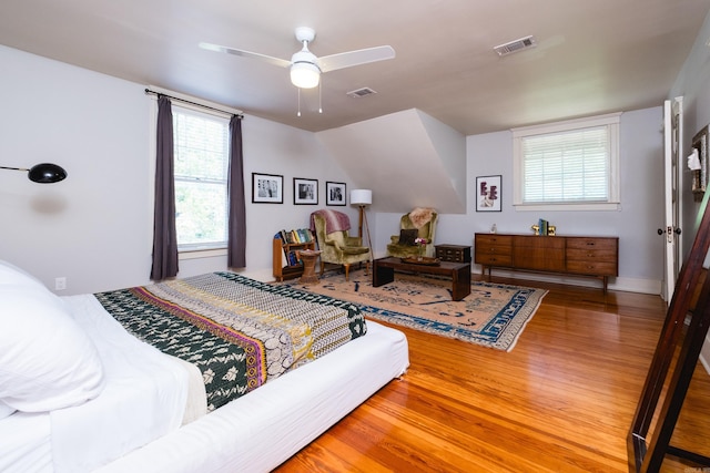 bedroom featuring wood finished floors and visible vents