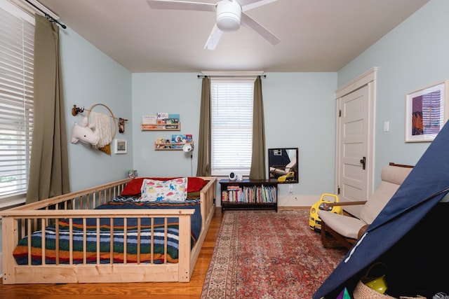 bedroom with wood finished floors and ceiling fan