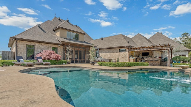pool with a pergola, area for grilling, and a patio