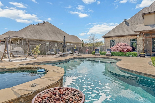 view of pool with a patio area, a fenced backyard, and a fenced in pool
