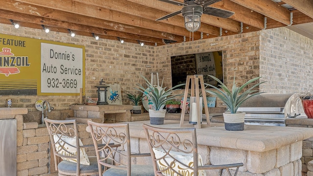 view of patio featuring a ceiling fan