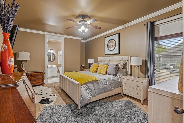 bedroom with light carpet, ensuite bath, ceiling fan, and crown molding