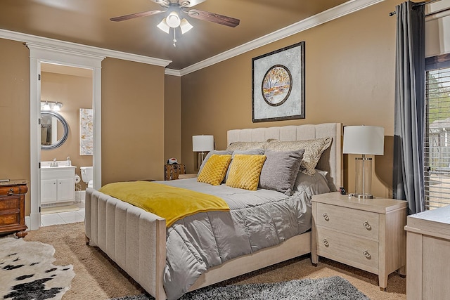 bedroom featuring ensuite bathroom, light colored carpet, ornamental molding, and a sink