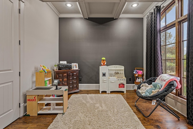 recreation room featuring dark wood-style floors, recessed lighting, and ornamental molding