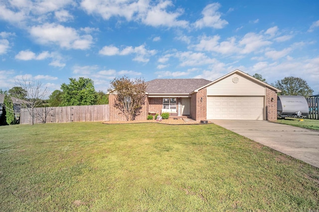 ranch-style home with concrete driveway, an attached garage, fence, a front yard, and brick siding