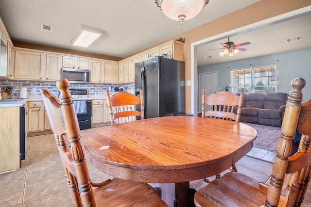 dining space with visible vents and ceiling fan