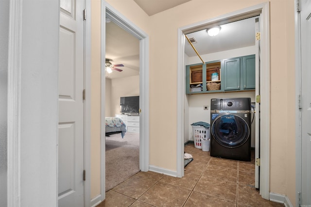 clothes washing area featuring visible vents, cabinet space, tile patterned flooring, ceiling fan, and washer / clothes dryer