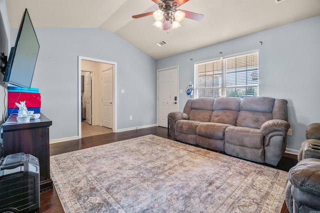 living room with lofted ceiling, wood finished floors, visible vents, baseboards, and ceiling fan