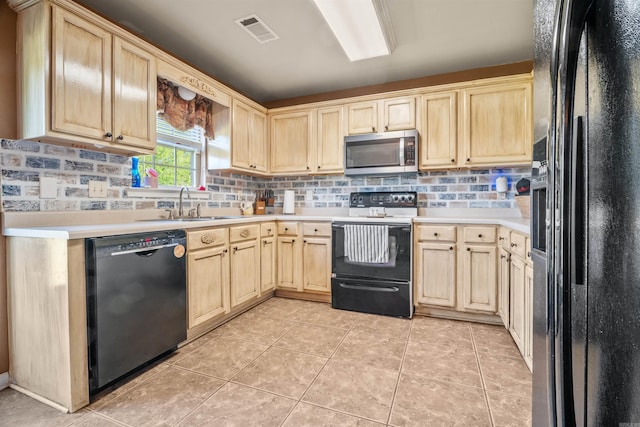 kitchen featuring a sink, visible vents, light brown cabinets, light countertops, and black appliances