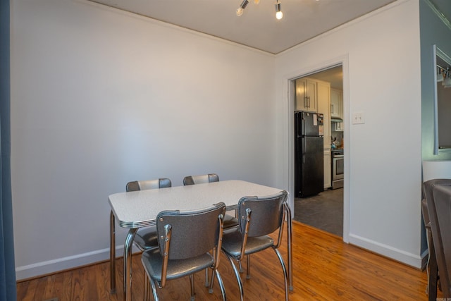 1020 Pine Valley Rd, Little Rock, AR 72207 - dining room featuring wood finished floors and baseboards