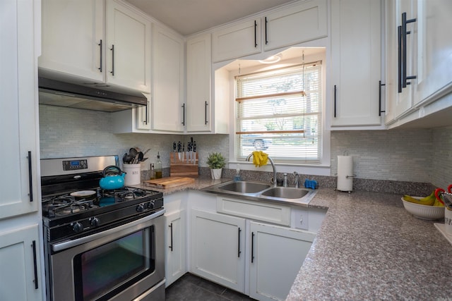 1020 Pine Valley Rd, Little Rock, AR 72207 - kitchen featuring white cabinets, under cabinet range hood, backsplash, a sink, and stainless steel range with gas cooktop
