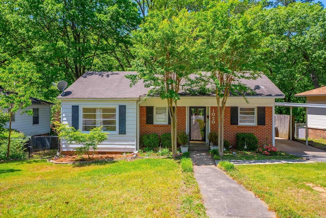 1020 Pine Valley Rd, Little Rock, AR 72207 - view of front of house with brick siding, a front lawn, fence, and a shingled roof