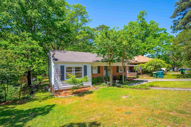 1020 Pine Valley Rd, Little Rock, AR 72207 - single story home featuring brick siding, a front lawn, fence, and a gate